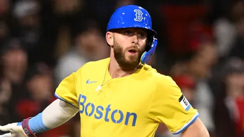 Trevor Story #10 high-fives Kristian Campbell #28 of the Boston Red Sox after scoring a run against the Chicago White Sox during the third inning at Fenway Park on April 18, 2025 in Boston, Massachusetts.