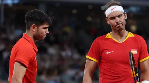 Rafael Nadal (R) and partner Carlos Alcaraz of Team Spain look dejected during the 2024 Paris Olympic Games.