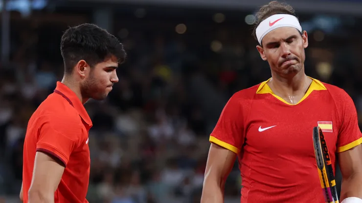 Rafael Nadal (R) and partner Carlos Alcaraz of Team Spain look dejected during the 2024 Paris Olympic Games.