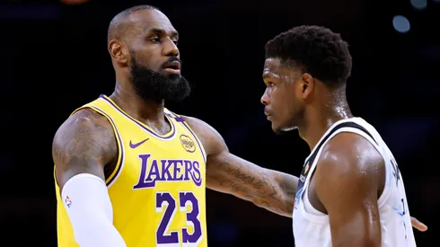 LeBron James #23 of the Los Angeles Lakers directs a play as he is guarded by Anthony Edwards #5 of the Minnesota Timberwolves during the first half at Crypto.com Arena on February 27, 2025 in Los Angeles, California.