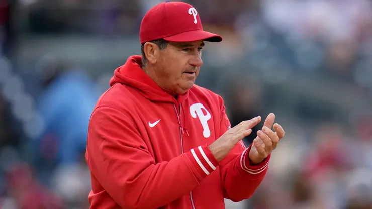 Rob Thomson #59 of the Philadelphia Phillies claps.