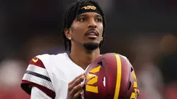 Jayden Daniels #5 of the Washington Commanders looks on during the second half against the Arizona Cardinals at State Farm Stadium on September 29, 2024 in Glendale, Arizona.