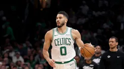 Jayson Tatum #0 of the Boston Celtics dribbles the ball in Game One of the Eastern Conference First Round NBA Playoffs against the Orlando Magic