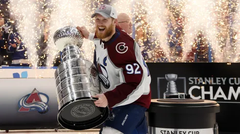 Gabriel Landeskog #92 of the Colorado Avalanche lifts the Stanley Cup after defeating the Tampa Bay Lightning 2-1 in Game Six of the 2022 NHL Stanley Cup Final.