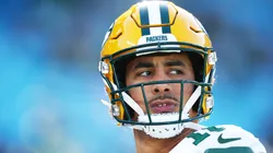 Jordan Love #10 of the Green Bay Packers warms up before the game against the Carolina Panthers at Bank of America Stadium on December 24, 2023 in Charlotte, North Carolina.