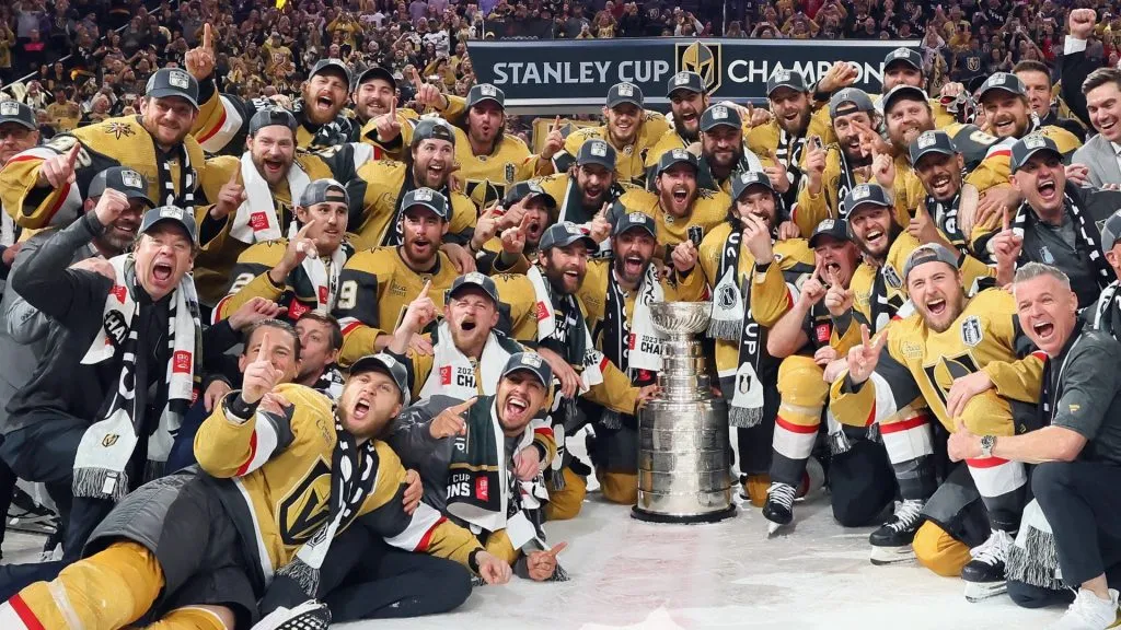 Members of the Vegas Golden Knights pose with the Stanley Cup after defeating the Florida Panthers to win the championship in Game Five of the 2023 NHL Stanley Cup Final. (Source: Bruce Bennett/Getty Images)
