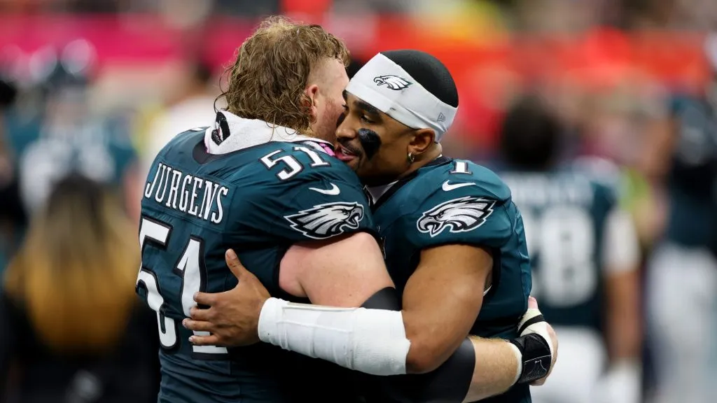 Cam Jurgens hugging Jalen Hurts