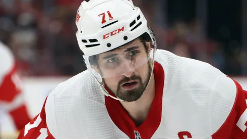 Dylan Larkin #71 of the Detroit Red Wings returns to the game after injury to take a faceoff against the Florida Panthers but departs afterwards at Amerant Bank Arena on March 30, 2024 in Sunrise, Florida.