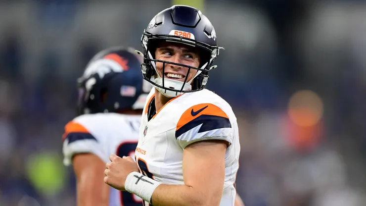 Bo Nix #10 of the Denver Broncos smiles after a touchdown during the second half of a preseason game against the Indianapolis Colts at Lucas Oil Stadium on August 11, 2024.