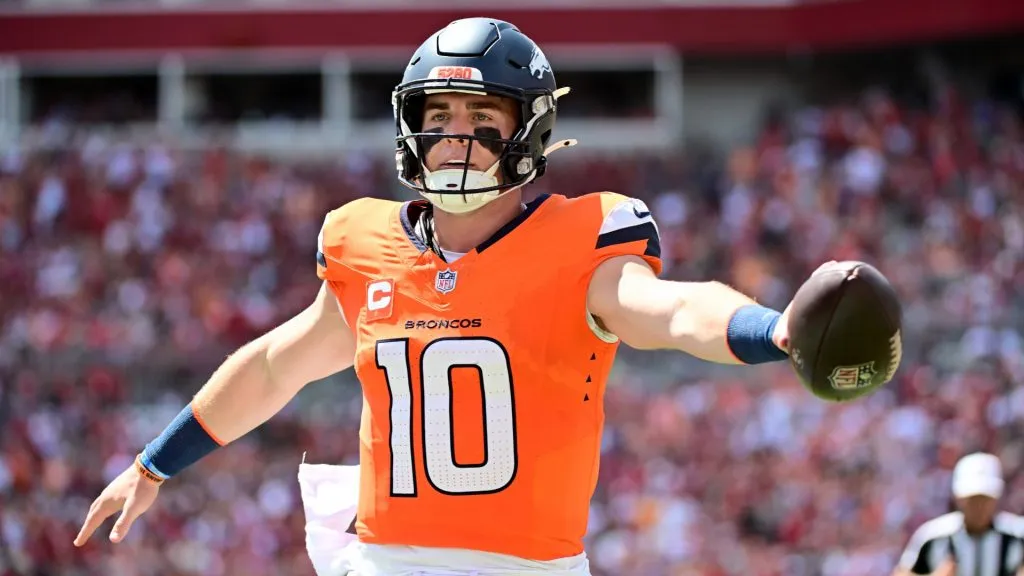 Quarterback Bo Nix #10 of the Denver Broncos rushes the ball for a touchdown against the Tampa Bay Buccaneers during the first quarter of the game in 2024. (Source: Julio Aguilar/Getty Images)