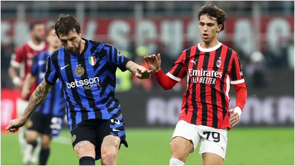 Francesco Acerbi of Inter passes the ball ahead of Joao Felix of AC Milan – Marco Luzzani/Getty Images