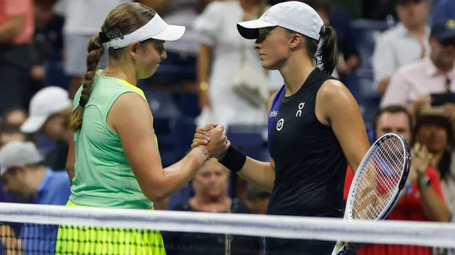 Jelena Ostapenko of Latvia embraces Iga Swiatek of Poland following her victory during the 2023 US Open. (Sarah Stier/Getty Images)