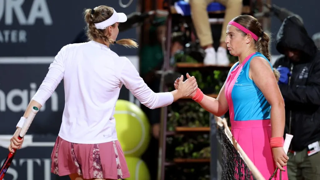 Jelena Ostapenko of Latvia shakes hands with Elena Rybakina of Kazakhstan following her defeat during the Masters of Rome. (Alex Pantling/Getty Images)