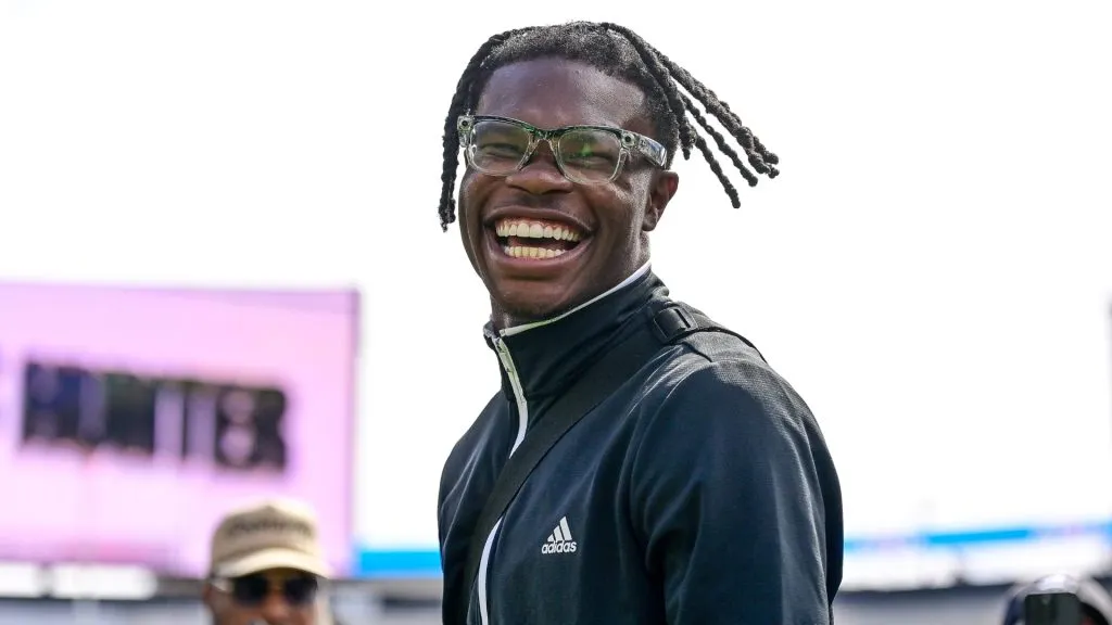 Former Colorado Buffaloes player Travis Hunter claps on the field during a ceremony where his jersey number was retired before the Black and Gold Spring Game in 2025. (Source: Dustin Bradford/Getty Images for ONIT)