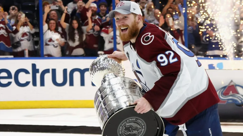 Gabriel Landeskog #92 of the Colorado Avalanche carries the Stanley Cup following the series winning victory over the Tampa Bay Lightning in Game Six of the 2022 NHL Stanley Cup Final. (Source: Bruce Bennett/Getty Images)