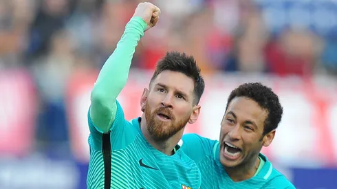 Lionel Messi celebrates with Neymar after scoring a goal during the La Liga match between Atletico de Madrid and Barcelona on February 26, 2017