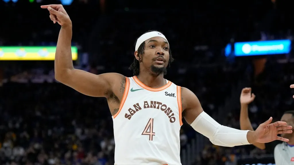 Devonteā Graham #4 of the San Antonio Spurs reacts after making a three-point shot against the Golden State Warriors during the third quarter at Chase Center on March 09, 2024 in San Francisco, California. (Photo by Thearon W. Henderson/Getty Images)