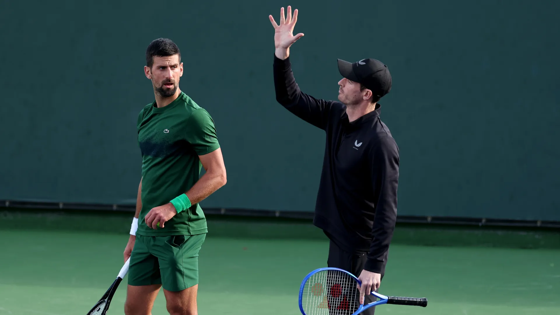 Andy Murray and Novak Djokovic during a training session. (Getty Images)