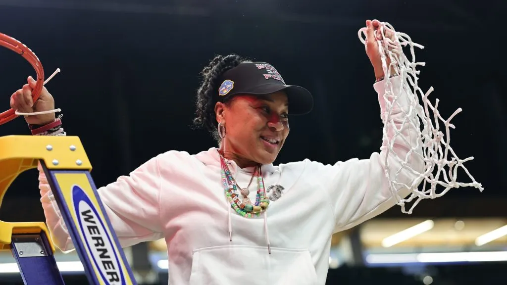 Head coach Dawn Staley of the South Carolina Gamecocks cuts down the net after defeating the Duke Blue Devils in the Elite Eight round of the NCAA Women’s Basketball Tournament. (Source: Carmen Mandato/Getty Images)