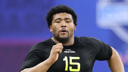 Derrick Harmon #DL15 of Oregon participates in the 40-yard dash during the NFL Scouting Combine at Lucas Oil Stadium