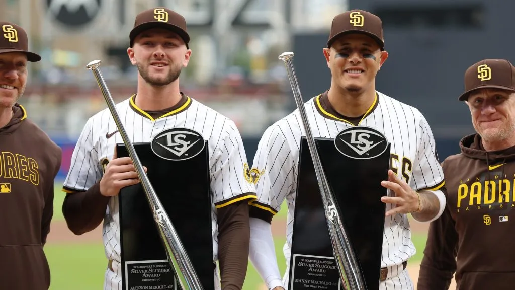 Manny Machado #13 and Jackson Merrill #3 of the San Diego Padres look on after being awarded the Silver Slugger award