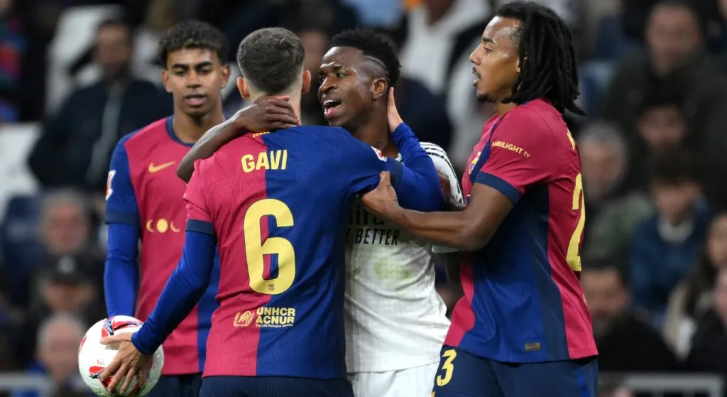 Barcelona and Real Madrid players having a heated argument during a La Liga game