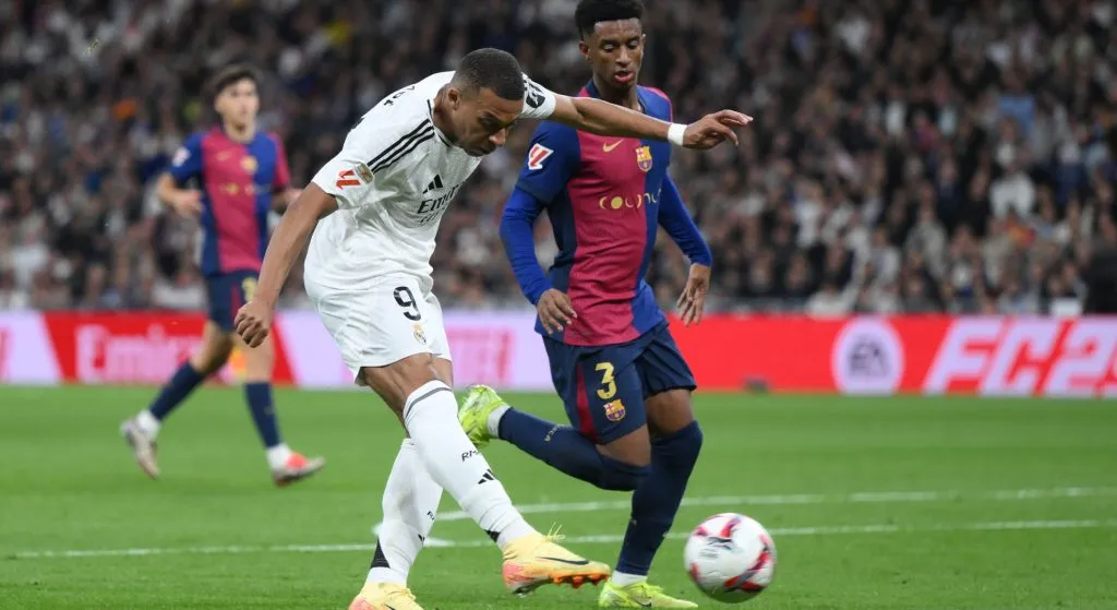 Kylian Mbappe shooting a ball with Real Madrid