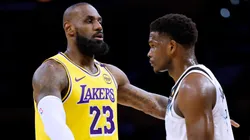 LeBron James #23 of the Los Angeles Lakers directs a play as he is guarded by Anthony Edwards #5 of the Minnesota Timberwolves.