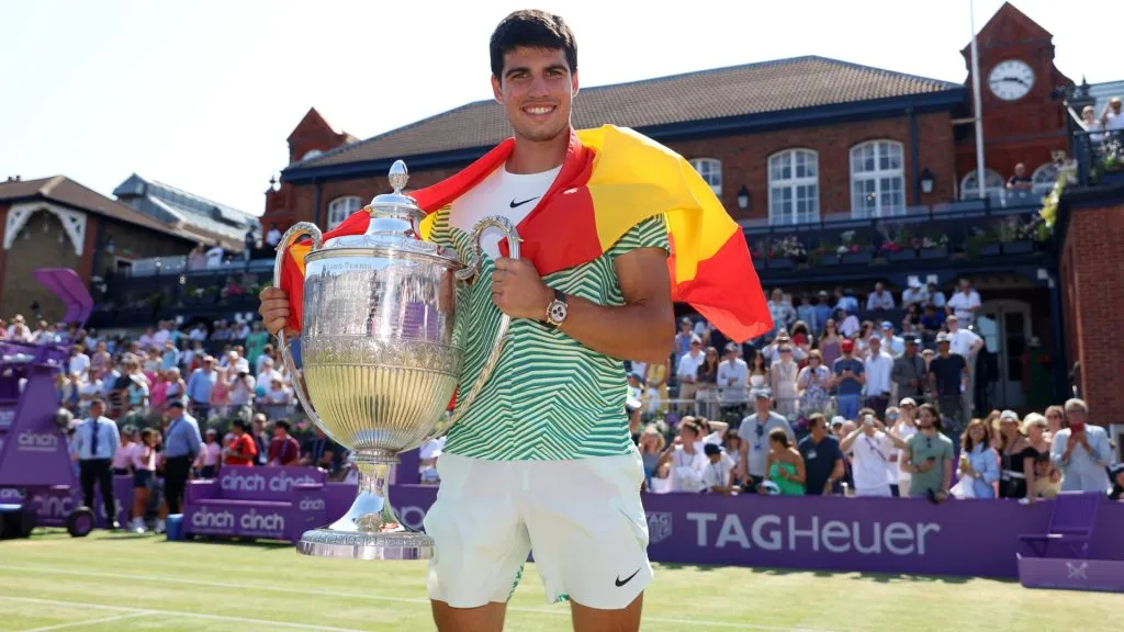 Carlos Alcaraz of Spain poses with the winner’s trophy after victory against Alex De Minaur of Australia at The Queen’s Club. (Luke Walker/Getty Images for LTA)