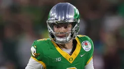 Dillon Gabriel #8 of the Oregon Ducks scrambles with the ball during the Rose Bowl game against the Ohio State Buckeyes at Rose Bowl Stadium on January 01, 2025 in Pasadena, California.