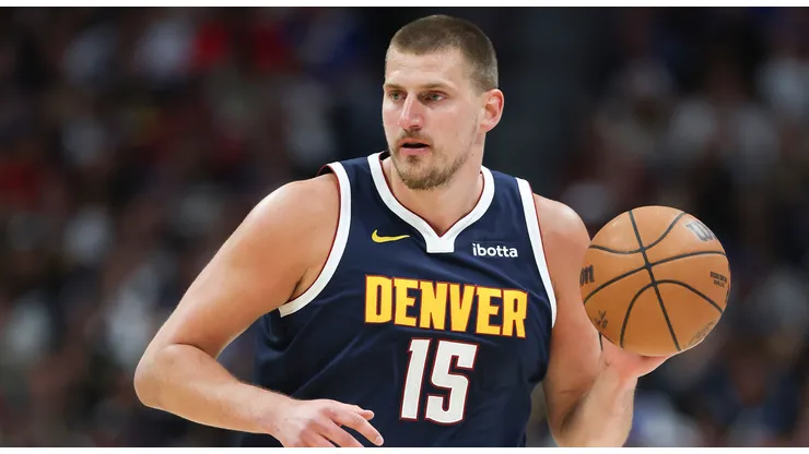 Nikola Jokic #15 of the Denver Nuggets brings the ball up the court during the first quarter against the Los Angeles Clippers.