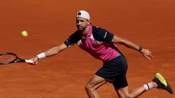 Grigor Dimitrov of Bulgaria plays a forehand against Jacob Fearnley of Great Britain during the Round of 32 match on Day Seven of the Mutua Madrid Open at La Caja Magica on April 28, 2025 in Madrid, Spain.