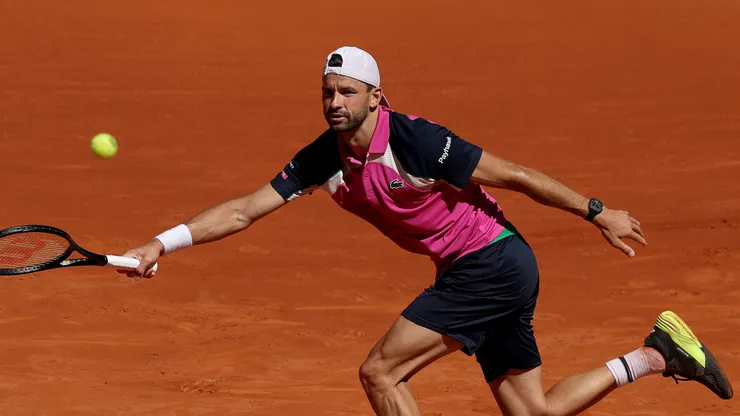 Grigor Dimitrov of Bulgaria plays a forehand against Jacob Fearnley of Great Britain during the Round of 32 match on Day Seven of the Mutua Madrid Open at La Caja Magica on April 28, 2025 in Madrid, Spain.