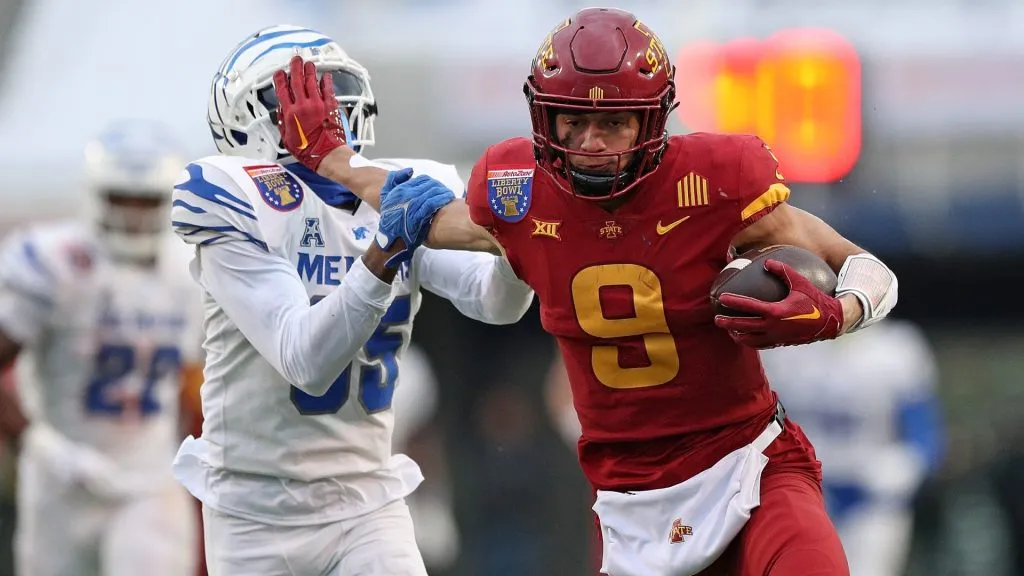 Jayden Higgins #9 of the Iowa State Cyclones stiff arms DJ Bell #35 of the Memphis Tigers during the first half of the 2023 AutoZone Liberty Bowl on December 29, 2023. (Source: Justin Ford/Getty Images)