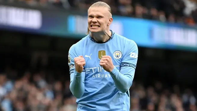 Erling Haaland of Manchester City celebrates after scoring his team’s first goal from the penalty spot during the Premier League match between Manchester City FC and Brighton & Hove Albion FC in 2025. (Source: Gareth Copley/Getty Images)