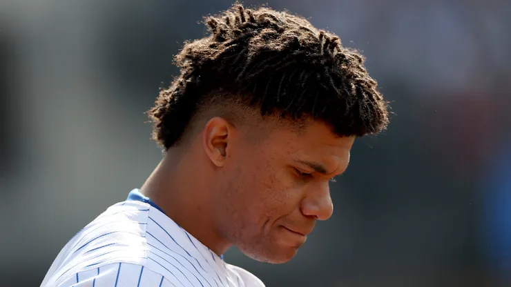 Juan Soto #22 of the New York Mets looks on as he stands in front of the dugout during the game against the St. Louis Cardinals at Citi Field on April 20, 2025