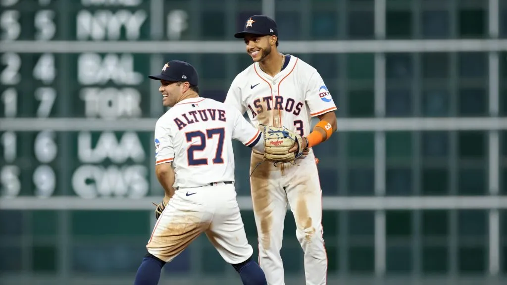 Jose Altuve #27 and Jeremy Peña #3 of the Houston Astros celebrate after their team defeated the New York Mets