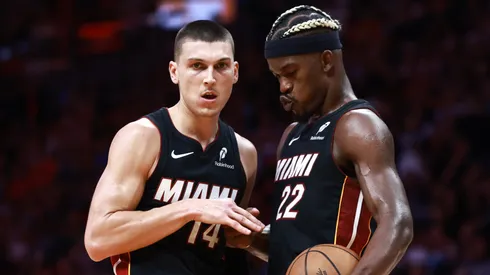 Jimmy Butler #22 of the Miami Heat high fives Tyler Herro #14 after he makes his free throw against the Sacramento Kings during the second half at Kaseya Center on November 04, 2024 in Miami, Florida.