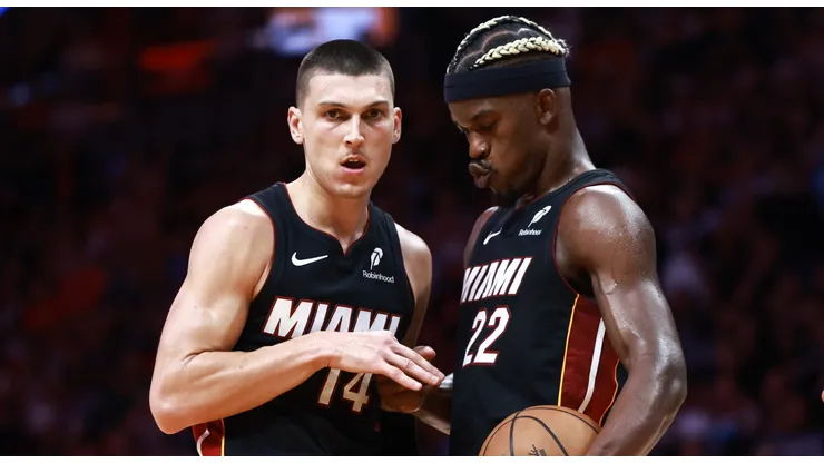 Jimmy Butler #22 of the Miami Heat high fives Tyler Herro #14 after he makes his free throw against the Sacramento Kings during the second half at Kaseya Center on November 04, 2024 in Miami, Florida.