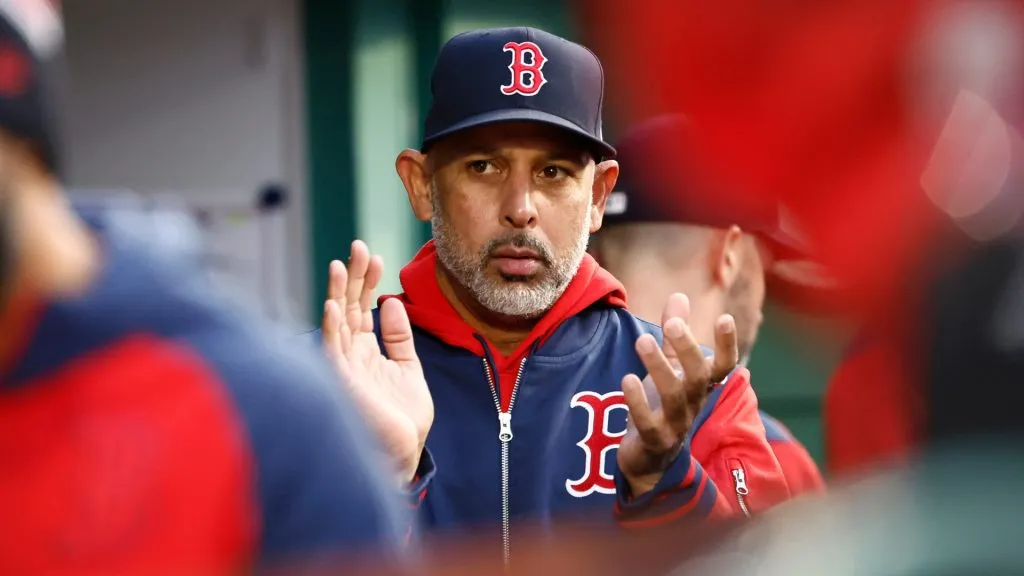 Manager Alex Cora #13 of the Boston Red Sox applauds in the dugout during the 10th inning of a 4-3 win over the Toronto Blue Jays at Fenway Park on April 10, 2025. (Source: Winslow Townson/Getty Images)