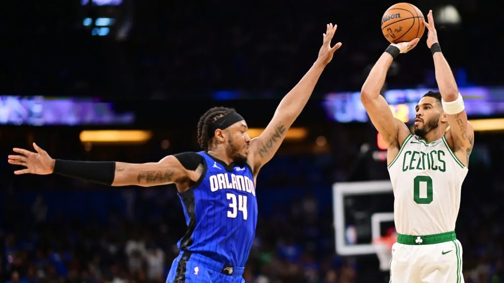 Jayson Tatum #0 of the Boston Celtics shoots a three-point-basket against Wendell Carter Jr. #34 of the Orlando Magic in the first half of game 4 of the 2025 NBA Playoffs. (Julio Aguilar/Getty Images)