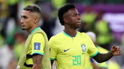 Raphinha and Vinicius look dejected after Brazil's elimination from the FIFA World Cup Qatar 2022