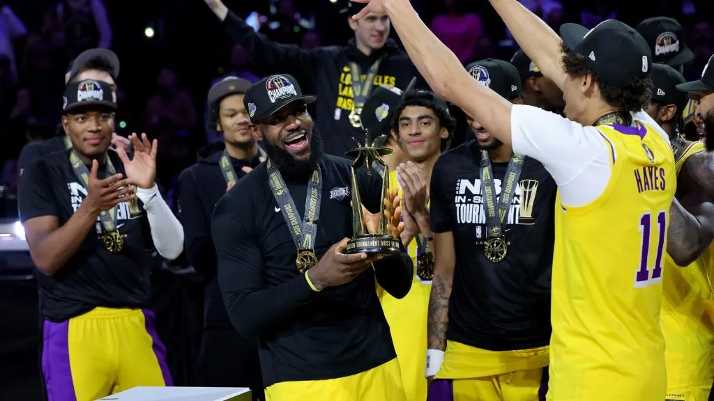 LeBron James #23 of the Los Angeles Lakers celebrates with the MVP trophy after winning the championship game of the inaugural NBA In-Season Tournament at T-Mobile Arena on December 09, 2023. (Source: Ethan Miller/Getty Images)