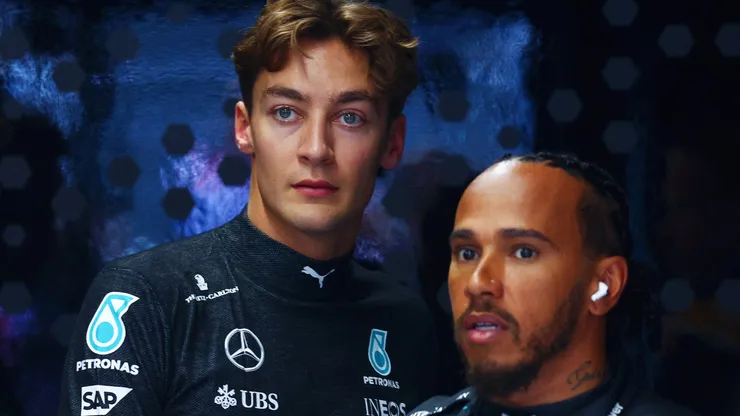 Lewis Hamilton of Great Britain and Mercedes and George Russell of Great Britain and Mercedes look on in the garage during final practice ahead of the F1 Grand Prix of Netherlands at Circuit Zandvoort.