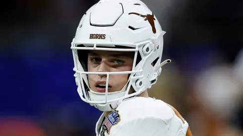 Arch Manning #16 of the Texas Longhorns warms up prior to playing against the Washington Huskies during the CFP Semifinal Allstate Sugar Bowl at Caesars Superdome on January 01, 2024 in New Orleans, Louisiana.