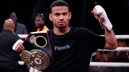 Rolando Romero poses after defeating Ismael Barroso for a vacant WBA super lightweight title at The Cosmopolitan of Las Vegas on May 13, 2023.