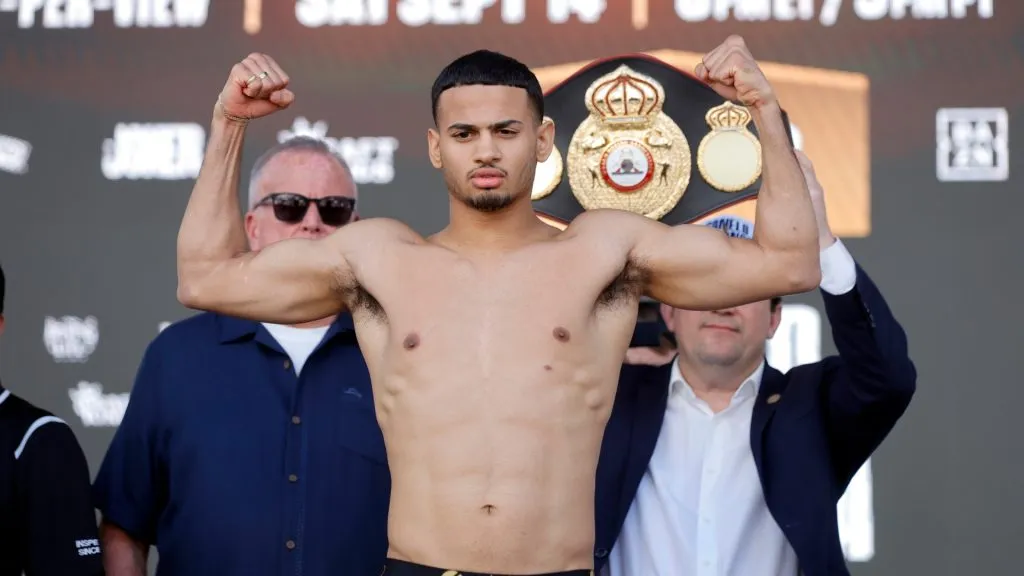Super lightweight boxer Rolando Romero poses on the scale during a ceremonial weigh-in in Toshiba Plaza at T-Mobile Arena on September 13, 2024. (Source: Steve Marcus/Getty Images)