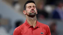 Novak Djokovic of Serbia reacts against Lorenzo Musetti of Italy in the Men's Singles third round match at Roland Garros.