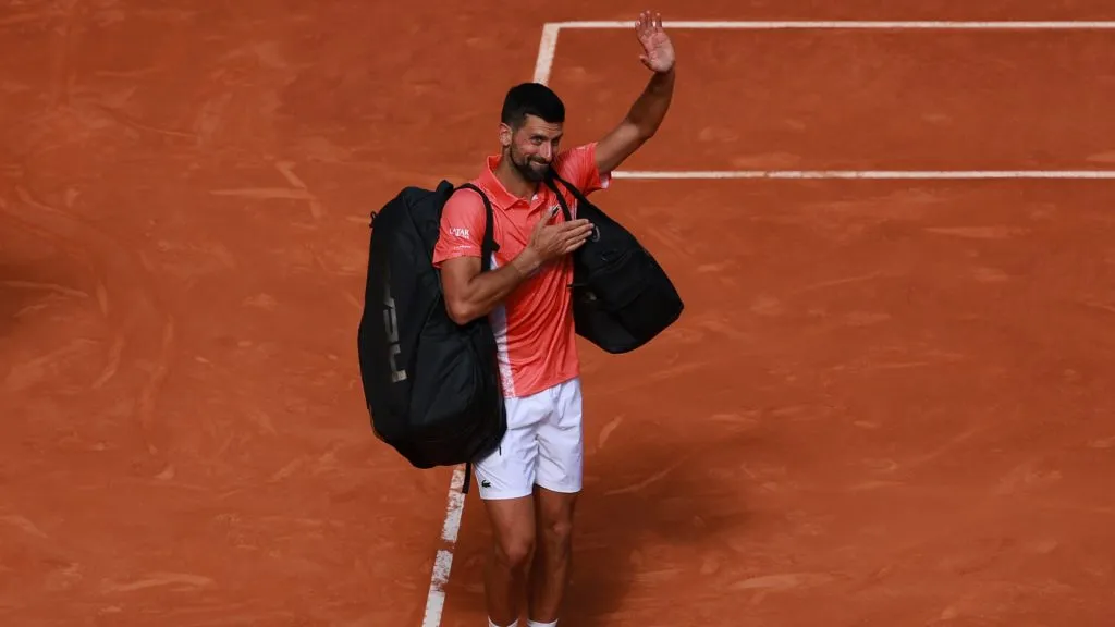Novak Djokovic waves to the crowd as he walks off court after his loss to Matteo Arnaldi in the Second Round match during the Madrid Open. (Clive Brunskill/Getty Images)