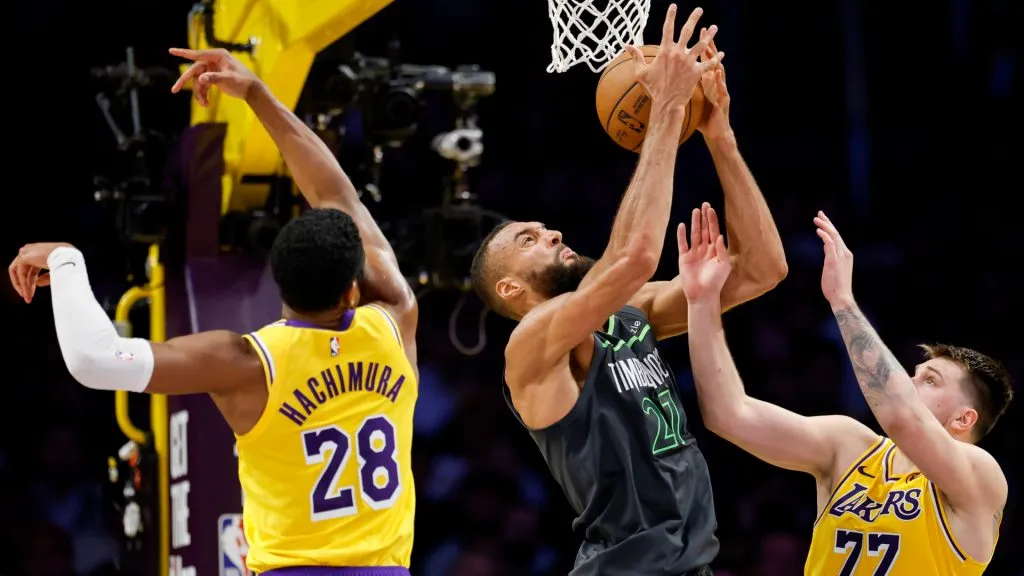 Rudy Gobert #27 of the Minnesota Timberwolves grabs a rebound between Rui Hachimura #28 and Luka Doncic #77 of the Los Angeles Lakers during Game 5. (Harry How/Getty Images)